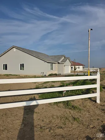 a view of a kitchen with a sink and a window