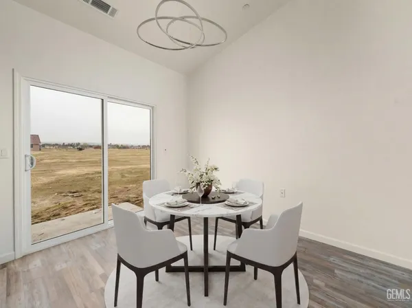 a kitchen with a sink a counter top space and cabinets