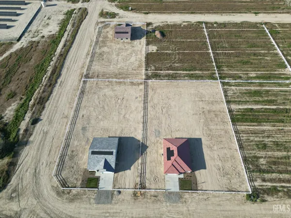 a spacious bedroom with a bed and a couch