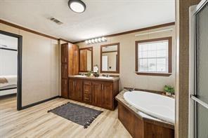 7466 County Road 573 Blue Ridge, TX 75424 - Photo 12 of 25 a bathroom with a granite countertop sink toilet and shower