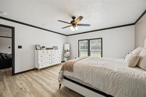 7466 County Road 573 Blue Ridge, TX 75424 - Photo 13 of 25 a bedroom with a bed and a large window
