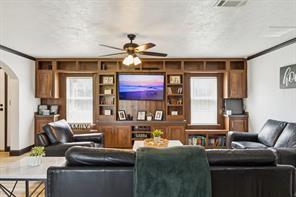 7466 County Road 573 Blue Ridge, TX 75424 - Photo 14 of 25 a living room with furniture a large window and a chandelier