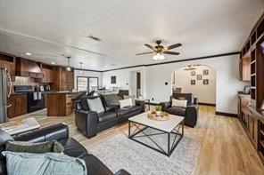 7466 County Road 573 Blue Ridge, TX 75424 - Photo 15 of 25 a living room with furniture kitchen view and a chandelier
