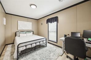 7466 County Road 573 Blue Ridge, TX 75424 - Photo 16 of 25 a bed room with a bed and a desk