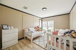 7466 County Road 573 Blue Ridge, TX 75424 - Photo 18 of 25 a bedroom with furniture and a window