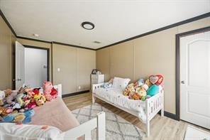 7466 County Road 573 Blue Ridge, TX 75424 - Photo 19 of 25 a bedroom with furniture and a table