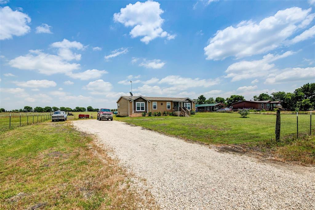 7466 County Road 573 Blue Ridge, TX 75424 - Photo 25 of 25 a view of a house with a yard