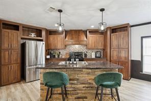 7466 County Road 573 Blue Ridge, TX 75424 - Photo 3 of 25 a kitchen with stainless steel appliances granite countertop a refrigerator dining table and chairs