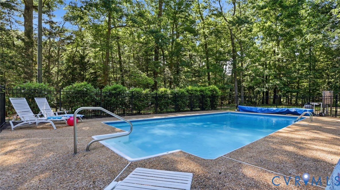 10716 Chalkley Road Richmond, VA 23237 - Photo 40 of 46 a view of a swimming pool with a lounge chair