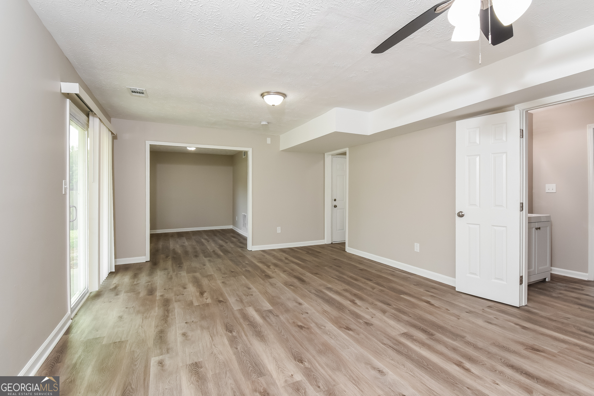 4809 Nature Trail Austell, GA 30106 - Photo 13 of 17 a view of an empty room and wooden floor