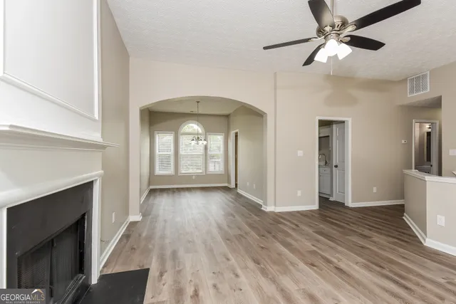a view of livingroom with hardwood floor and a ceiling fan