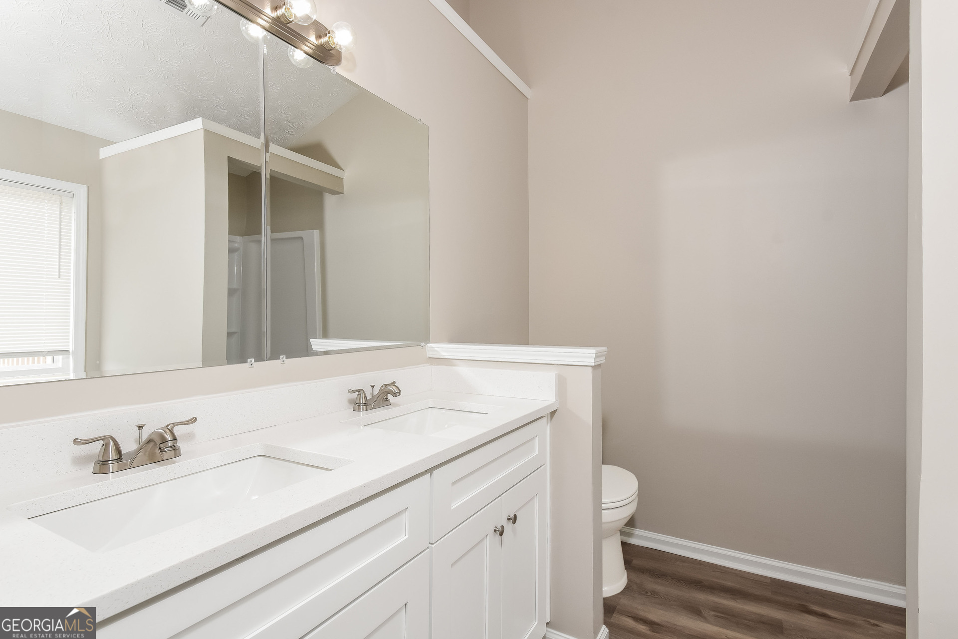 4809 Nature Trail Austell, GA 30106 - Photo 9 of 17 a bathroom with a sink a toilet and a mirror