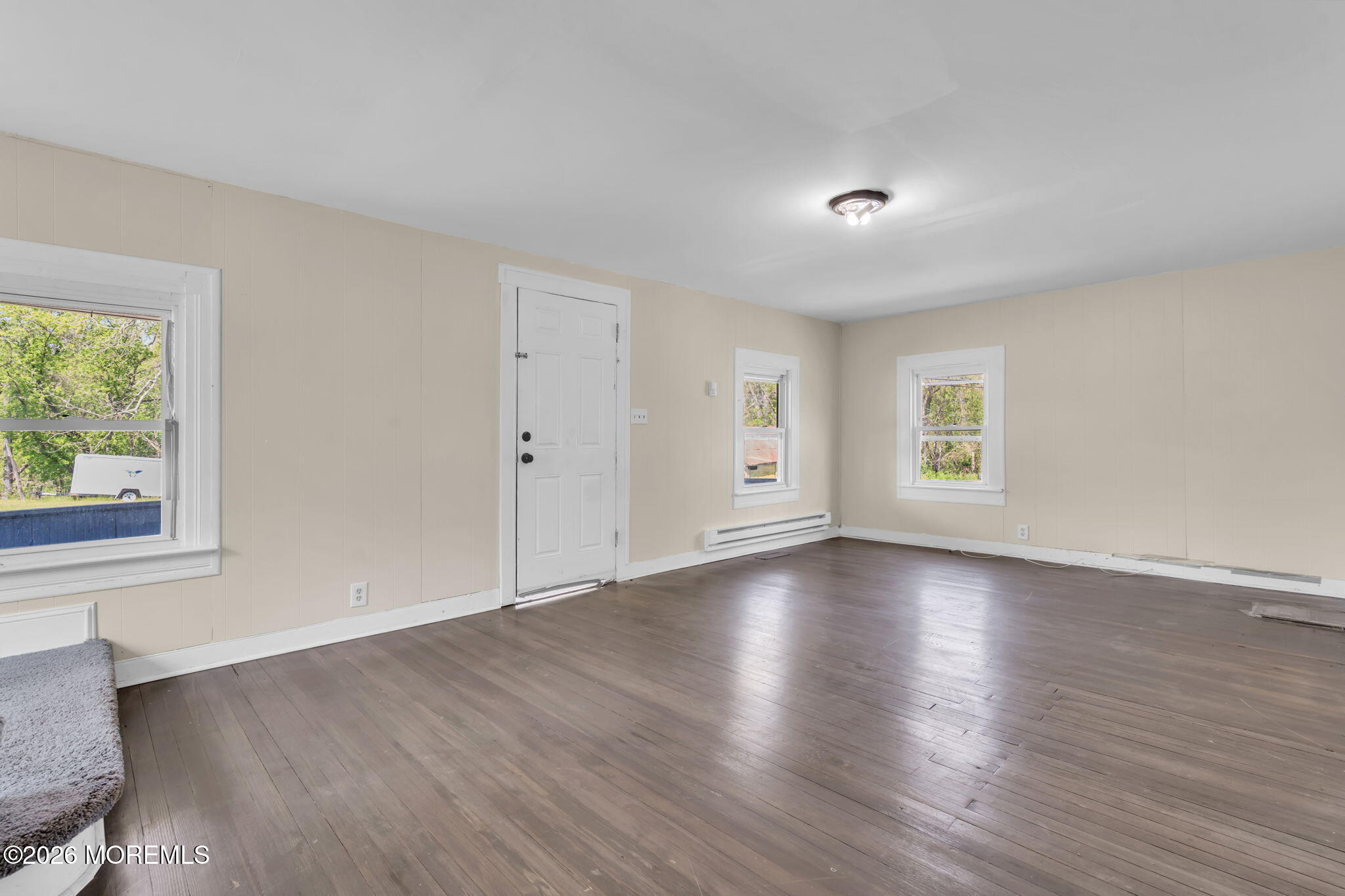 9 Arneytown-Hornerstown Road Cream Ridge, NJ 08514 - Photo 46 of 58 an empty room with wooden floor and windows