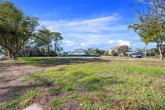 a view of outdoor space with swimming pool and green space