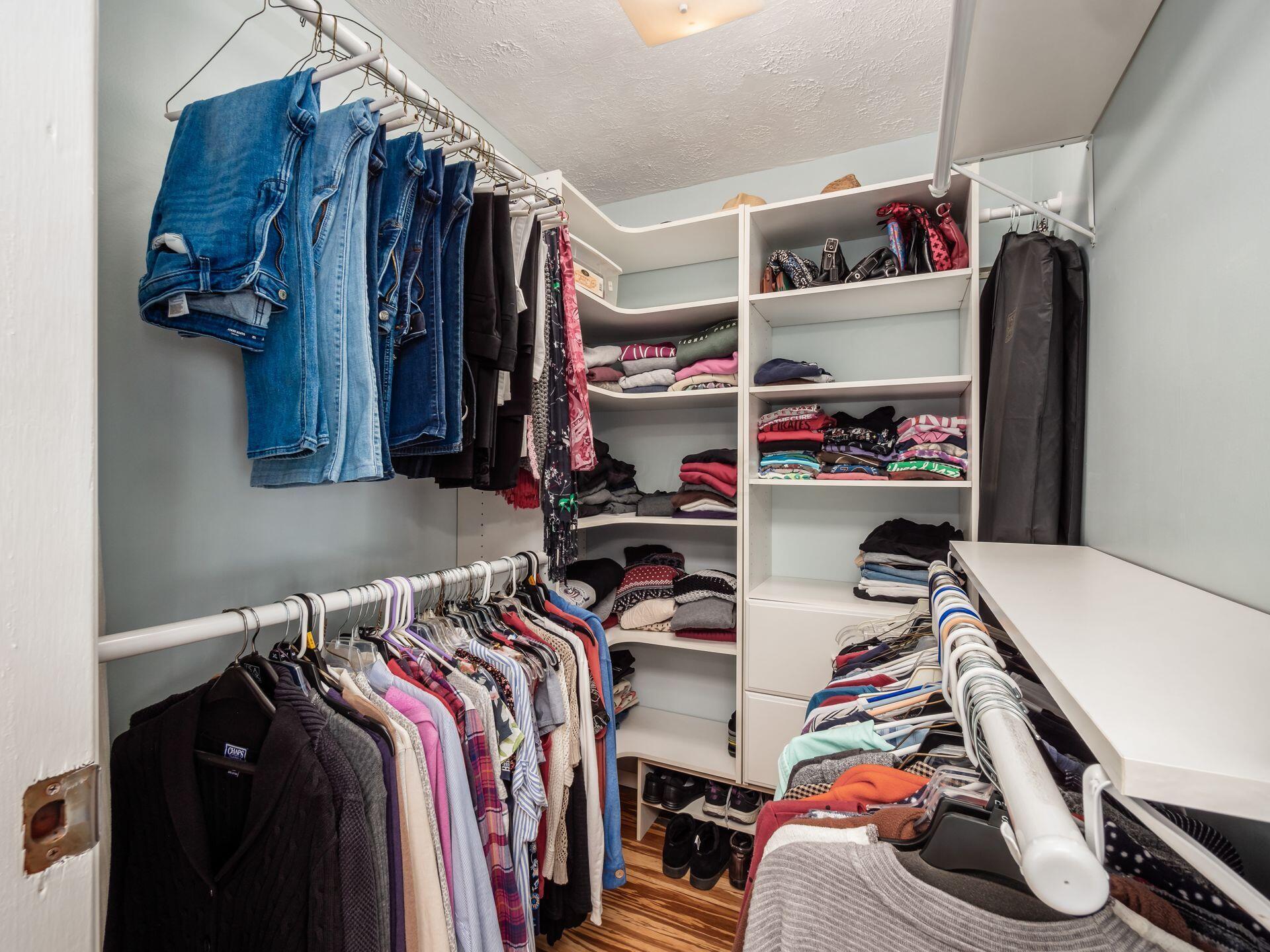 12741 Goodman Road Ashville, OH 43103 - Photo 21 of 61 The primary walk-in closet offers plenty of storage with an upgraded organization system