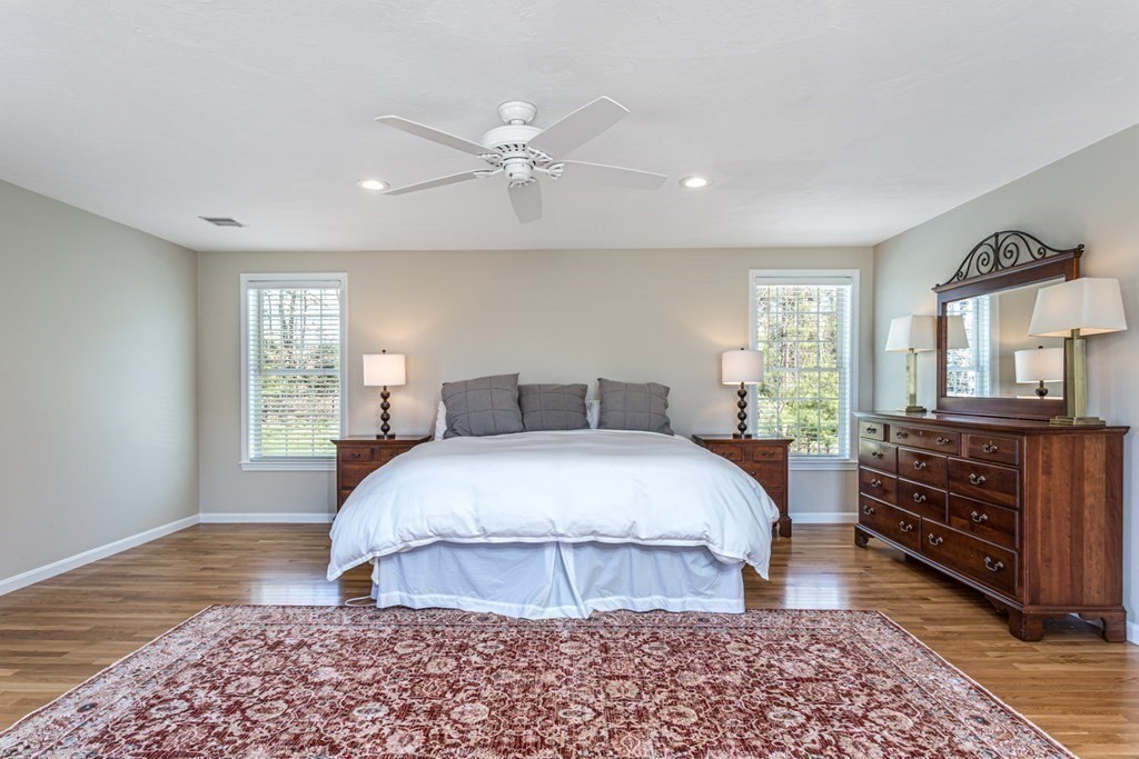 4 Griffin Road Franklin, MA 02038 - Photo 22 of 42 a spacious bedroom with a bed and wooden floor