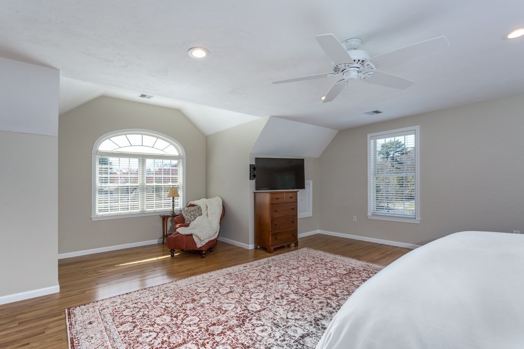 4 Griffin Road Franklin, MA 02038 - Photo 23 of 42 a bedroom with a bed and wooden floor
