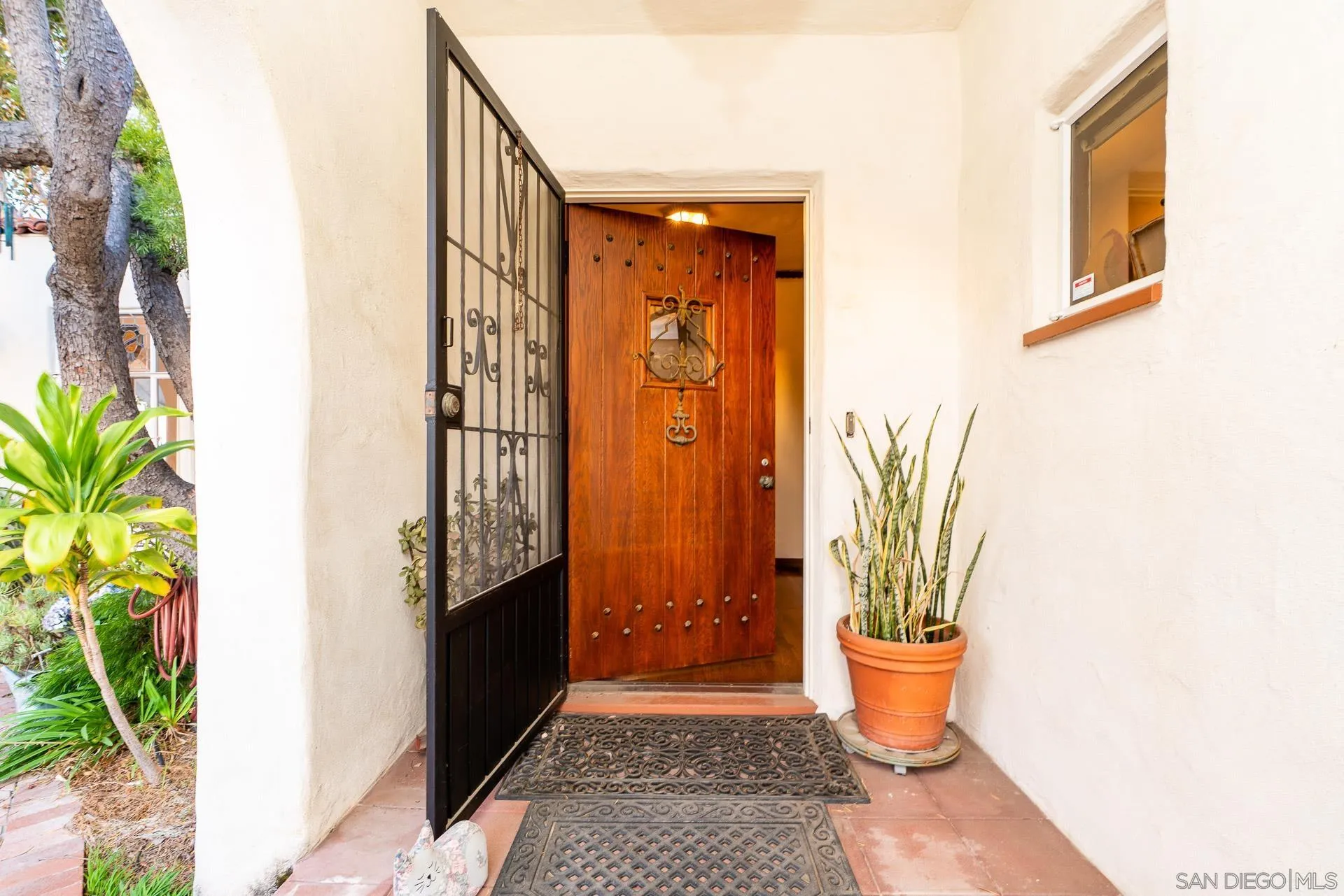 553 Rimrock Road El Cajon, CA 92020 - Photo 13 of 43 a front view of a house with a potted plant