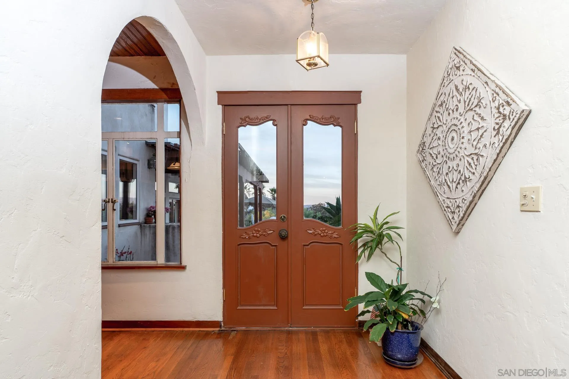 553 Rimrock Road El Cajon, CA 92020 - Photo 19 of 43 a view of front door with potted plant
