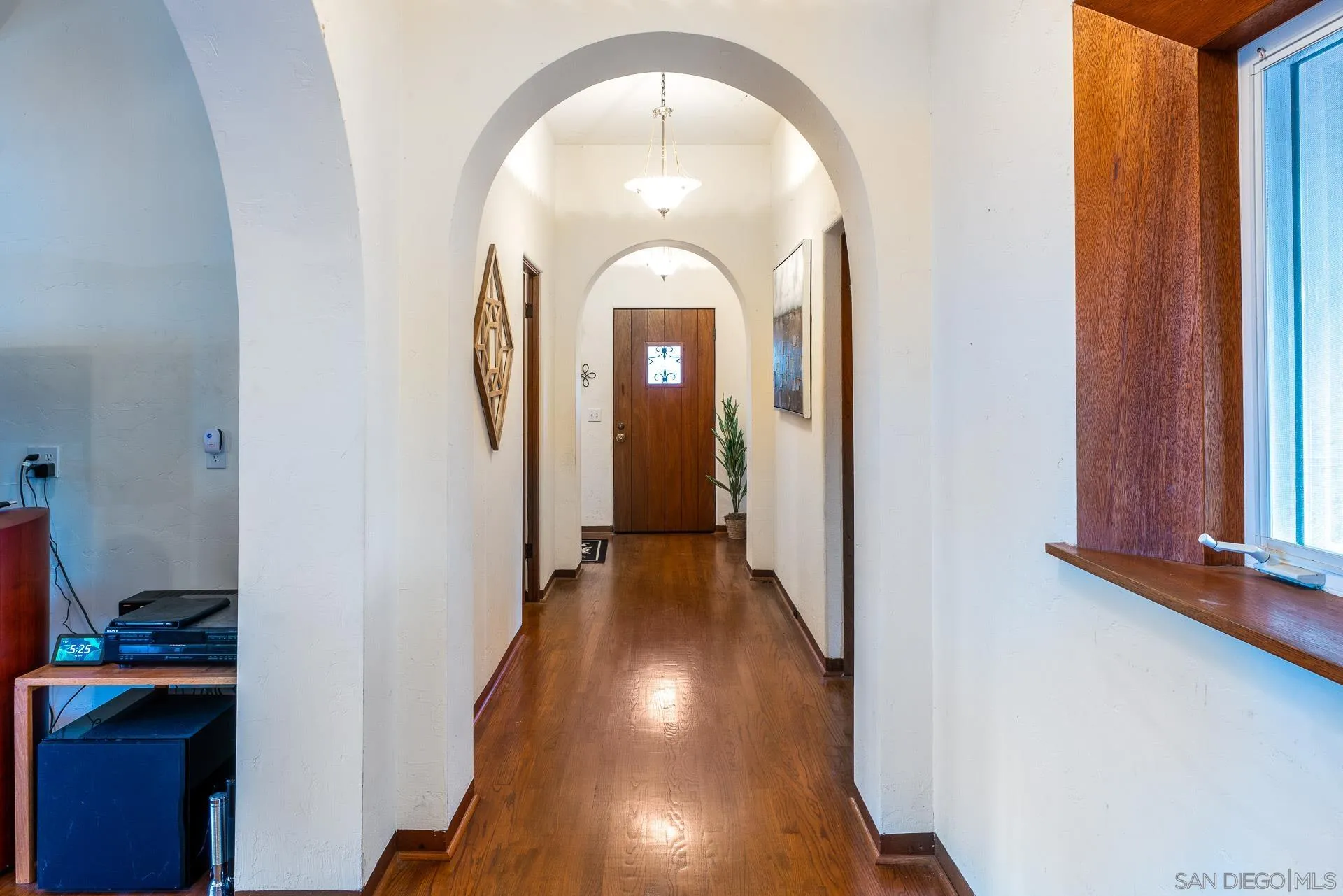 553 Rimrock Road El Cajon, CA 92020 - Photo 22 of 43 a view of a livingroom with wooden floor and entryway