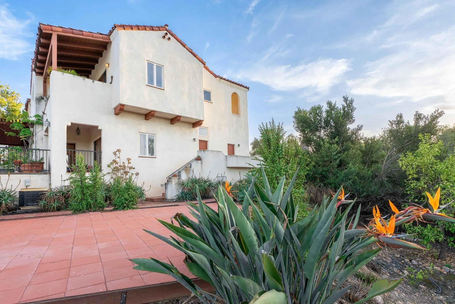 553 Rimrock Road El Cajon, CA 92020 - Photo 41 of 43 a view of a white house with a yard and plants