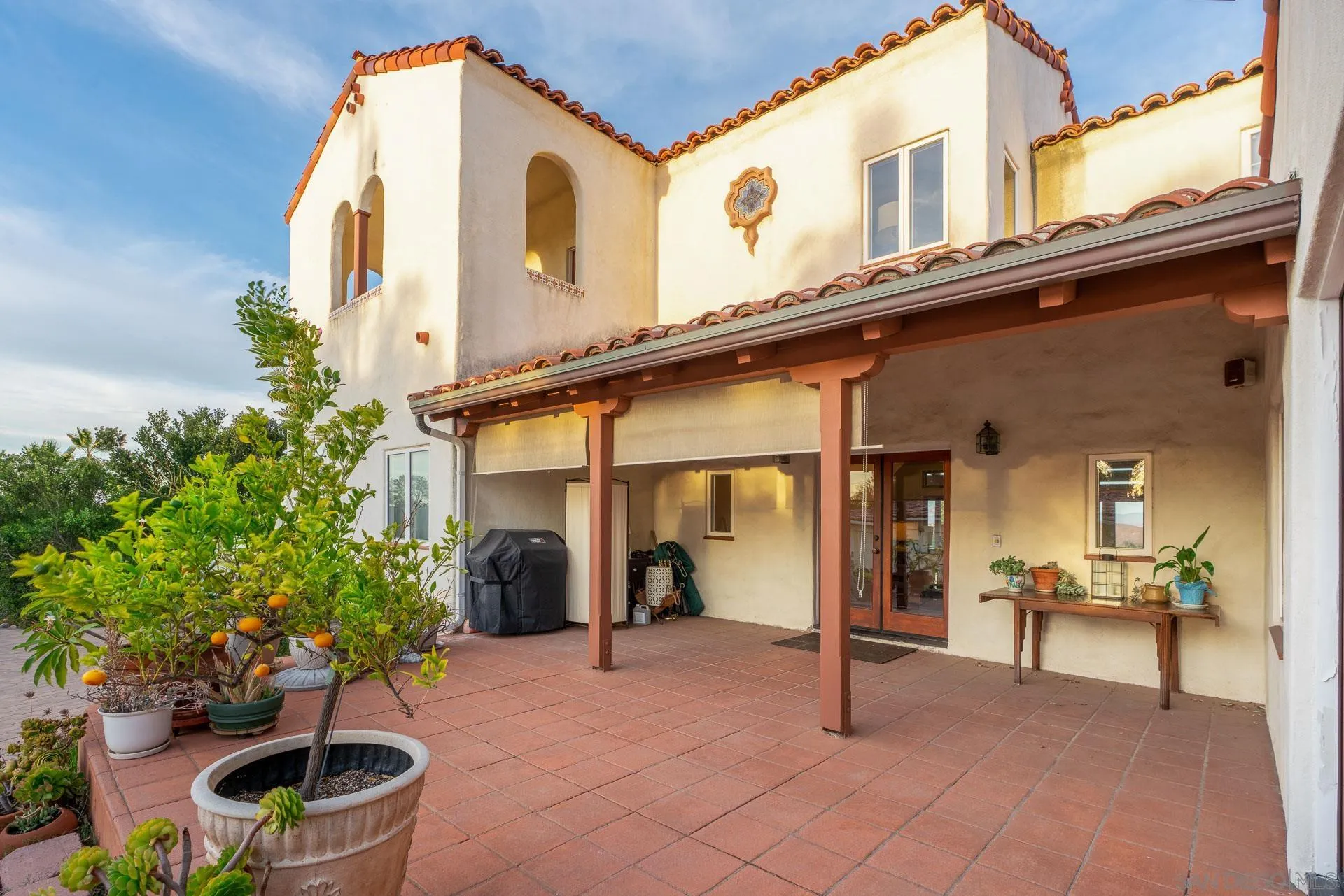 553 Rimrock Road El Cajon, CA 92020 - Photo 9 of 43 a view of a chair and tables in patio of the house