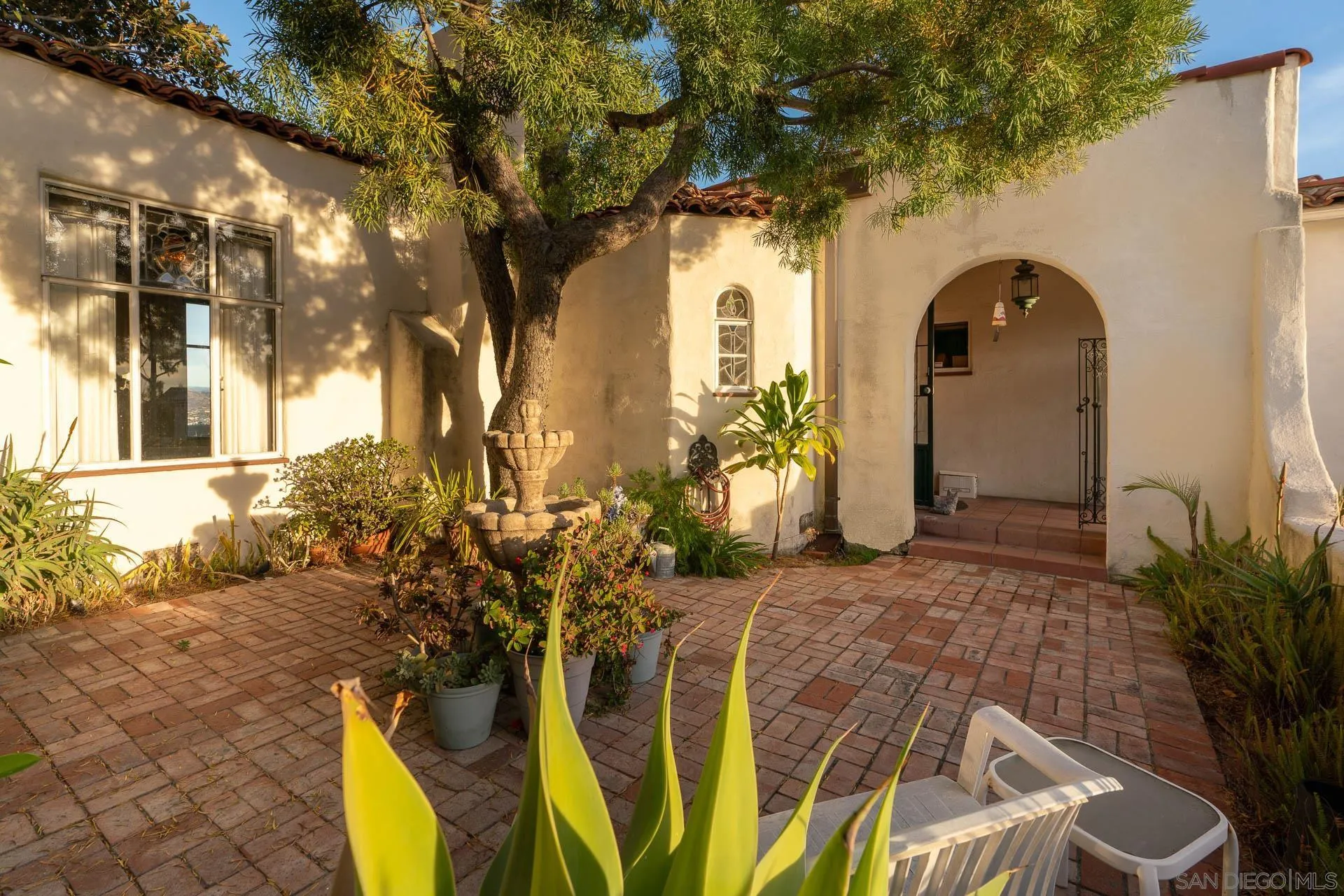 553 Rimrock Road El Cajon, CA 92020 - Photo 10 of 43 a couple of potted plants sitting in front of a house