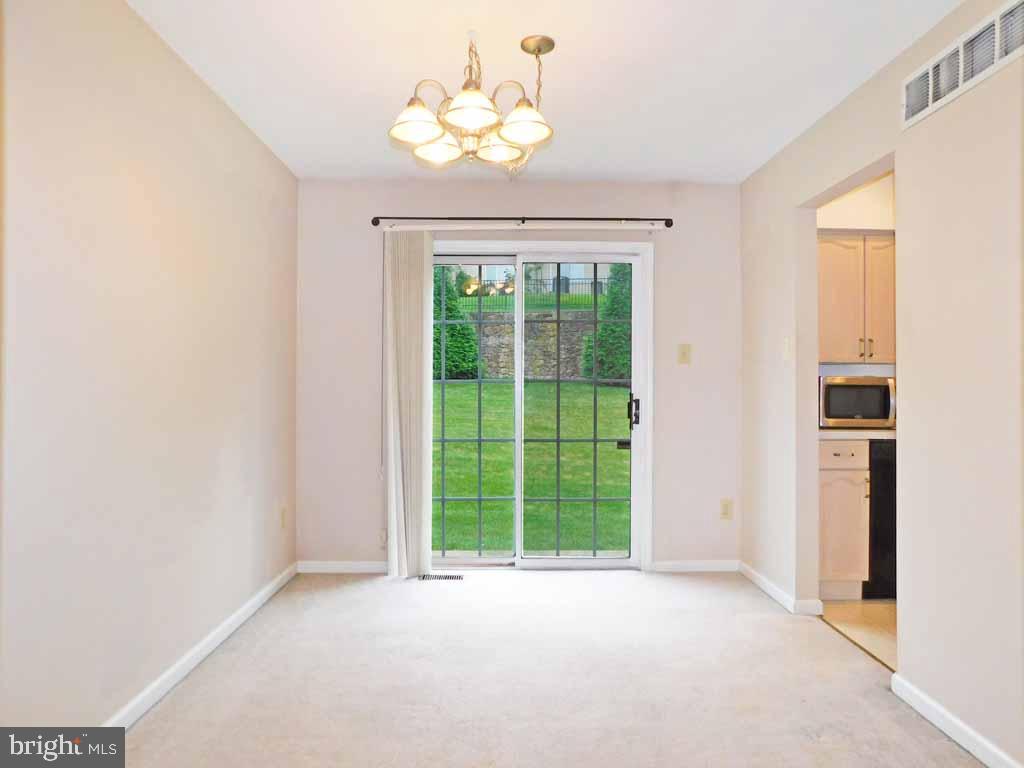 5469 Rinker Circle, Unit 299 Doylestown, PA 18902 - Photo 5 of 21 Dining Room with Sliders
