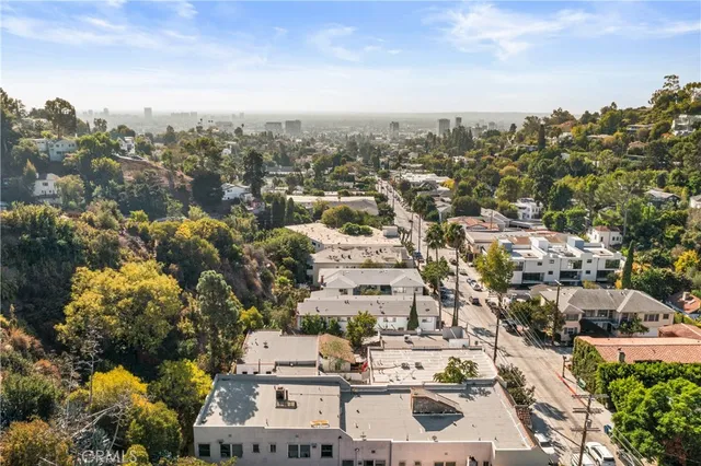 a view of entryway with a large window and wooden floor