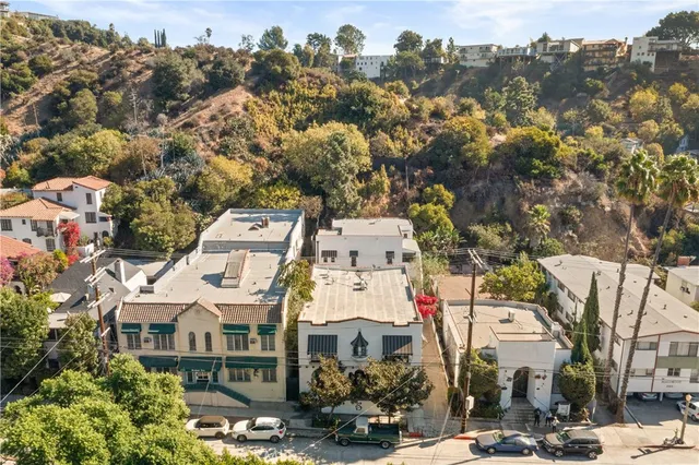 a living room with furniture chess board and a window