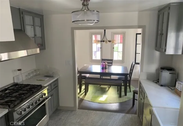a kitchen with a stove and a refrigerator
