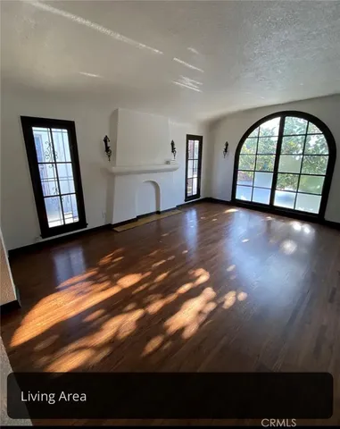 a view of hall way with furniture