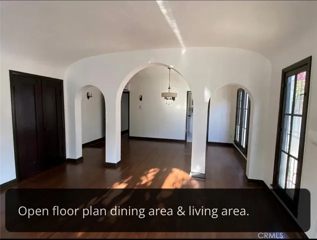 a view of a livingroom with wooden floor
