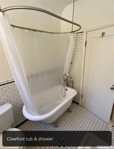 a view of a bathroom with sink and mirror