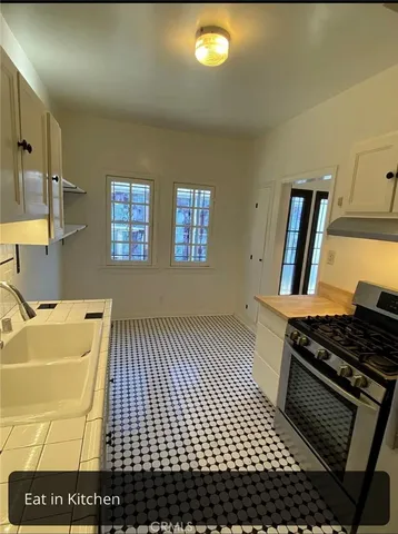 a kitchen with a sink and cabinets