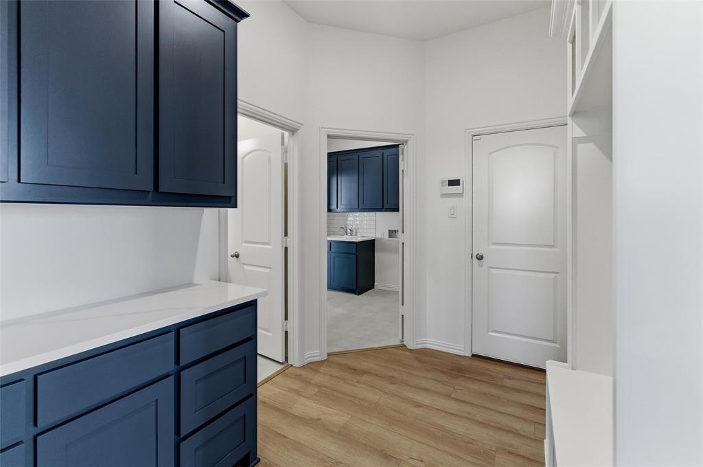 405 Hayden Faith Court Springtown, TX 76082 - Photo 11 of 30 a kitchen with a refrigerator and cabinets