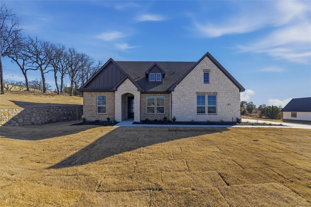 405 Hayden Faith Court Springtown, TX 76082 - Photo 2 of 30 a front view of a house with a yard