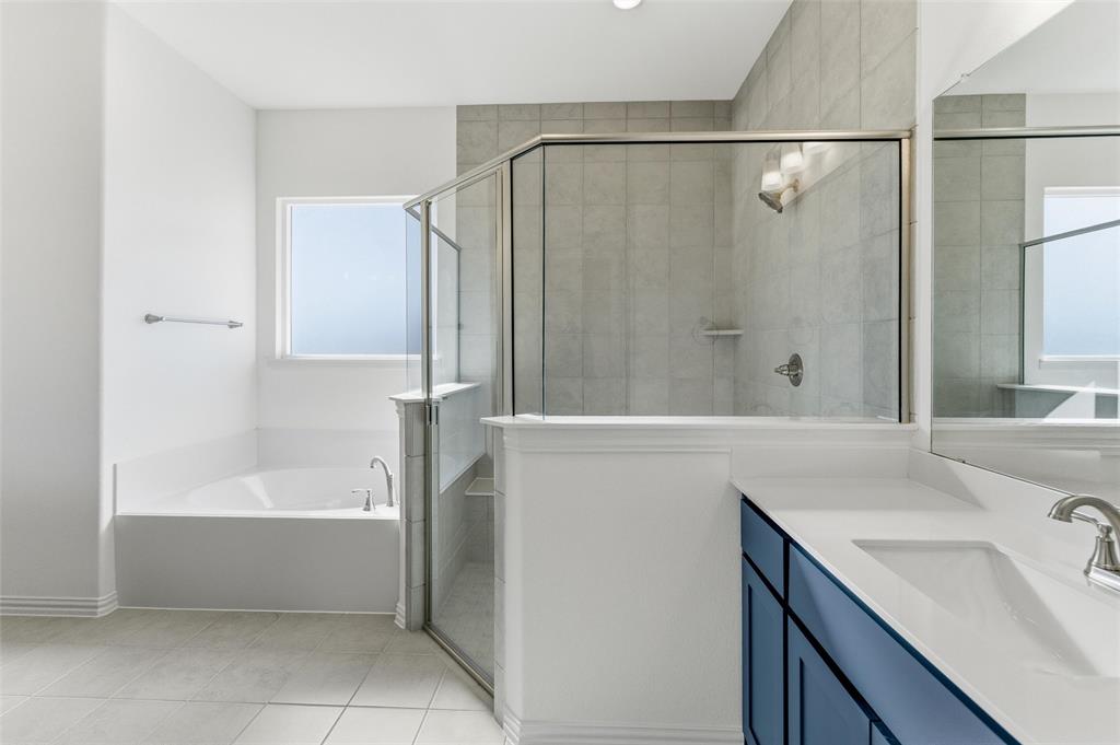 405 Hayden Faith Court Springtown, TX 76082 - Photo 23 of 30 a bathroom with a bathtub and a sink