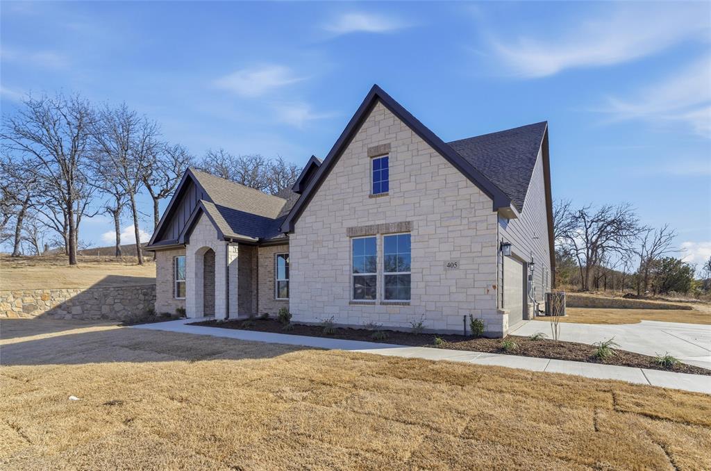 405 Hayden Faith Court Springtown, TX 76082 - Photo 3 of 30 a view of a house with a yard