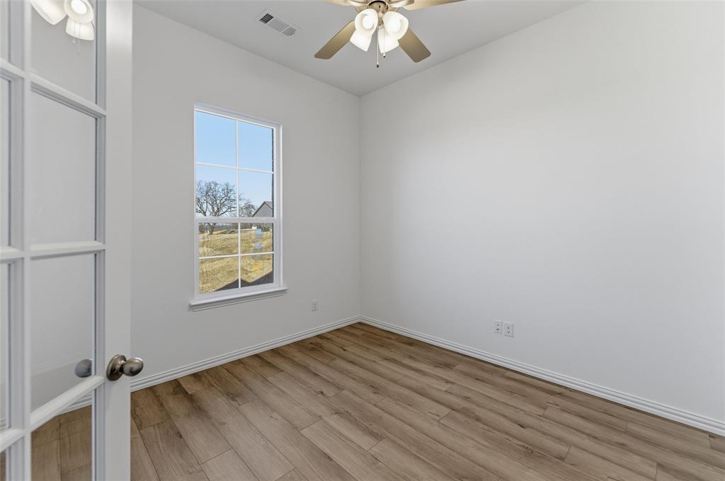405 Hayden Faith Court Springtown, TX 76082 - Photo 6 of 30 an empty room with a window