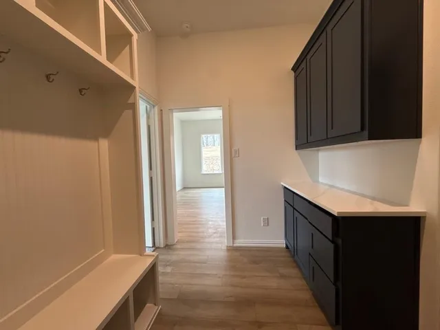 a kitchen with granite countertop a sink and a stove