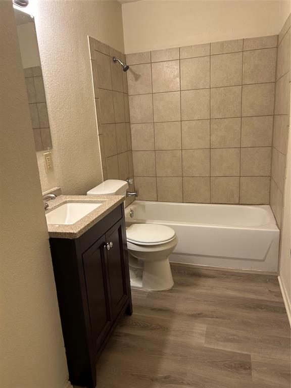 1836 Coral Road Pelican Bay, TX 76020 - Photo 11 of 13 a bathroom with a sink a toilet and bathtub