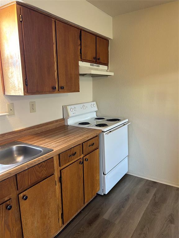 1836 Coral Road Pelican Bay, TX 76020 - Photo 7 of 13 a kitchen with a sink and cabinets
