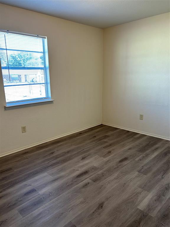 1836 Coral Road Pelican Bay, TX 76020 - Photo 8 of 13 a view of a small space with wooden floor and a window