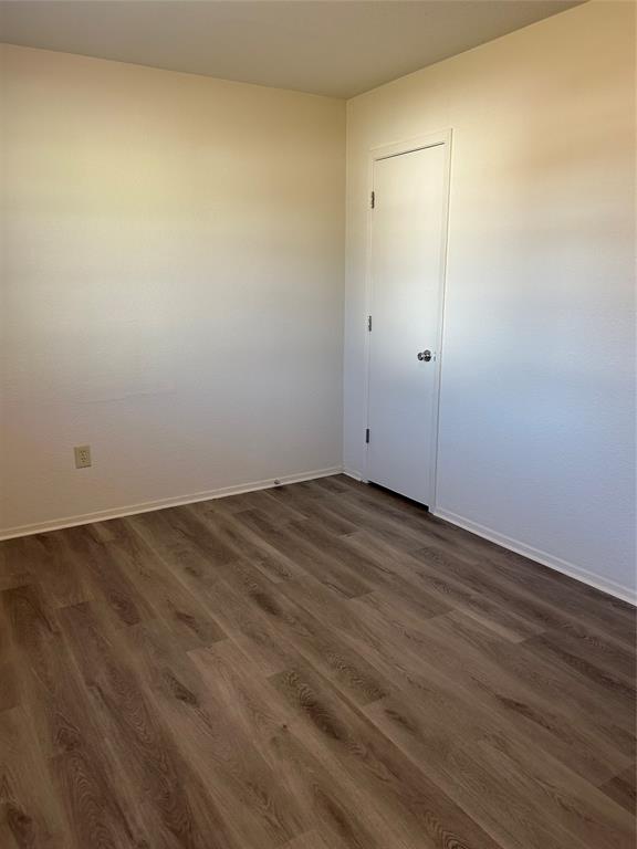 1836 Coral Road Pelican Bay, TX 76020 - Photo 10 of 13 an empty room with wooden floor