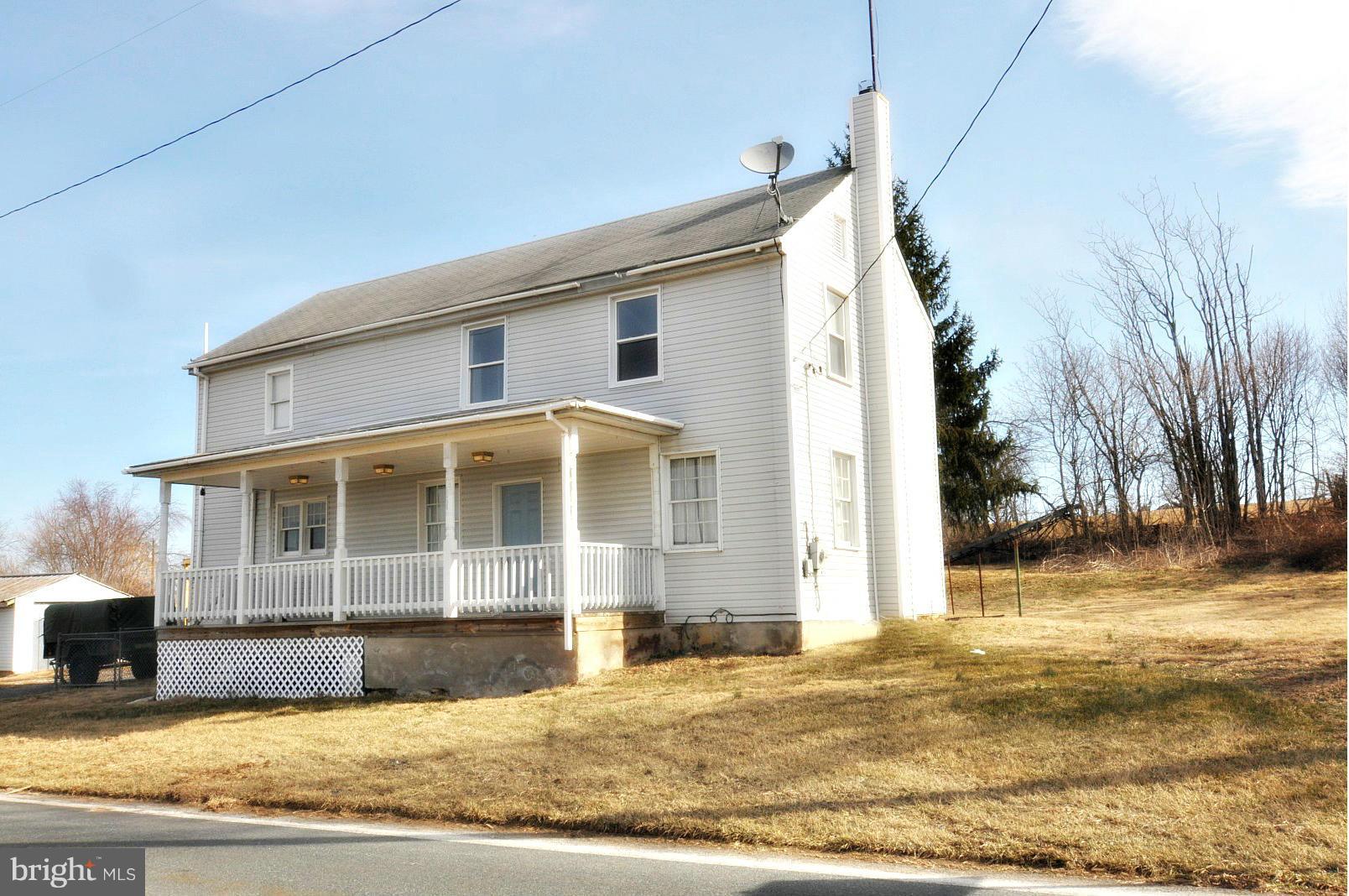 1460 Marble Quarry Road Union Bridge, MD 21791 - Photo 1 of 25 a view of a white house with a yard