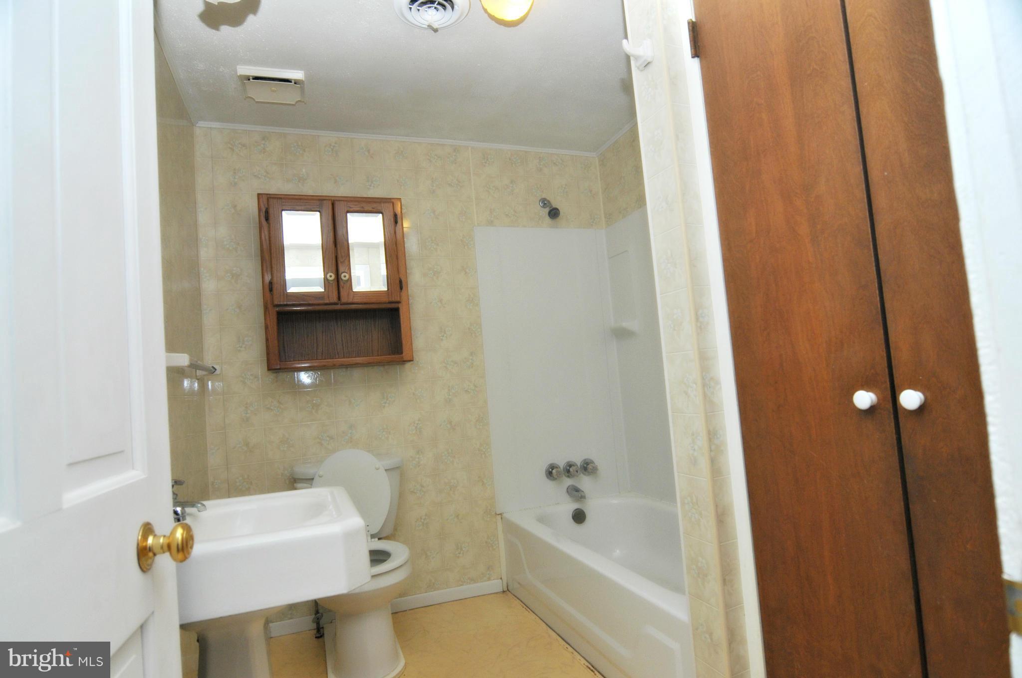 1460 Marble Quarry Road Union Bridge, MD 21791 - Photo 23 of 25 a bathroom with a sink toilet and shower