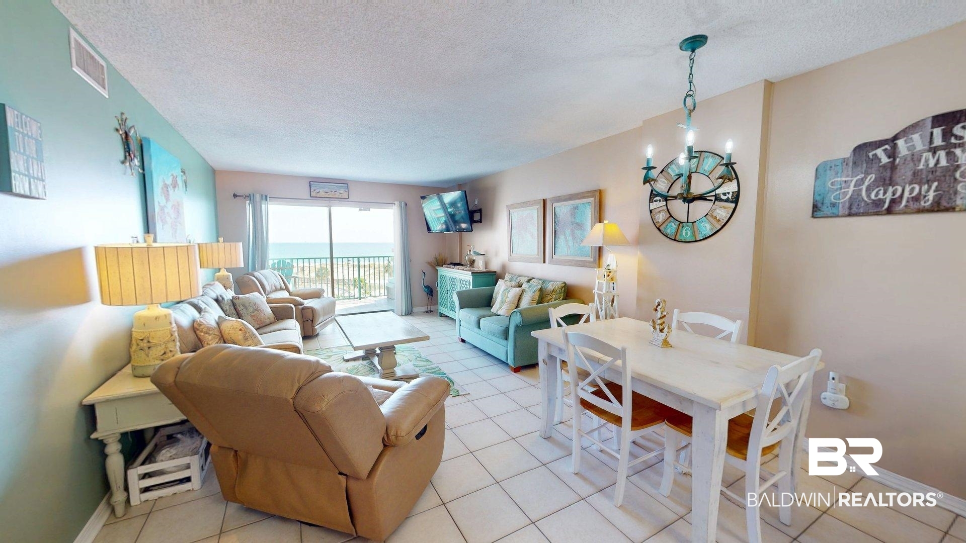645 Plantation Road, Unit 6503 Gulf Shores, AL 36542 - Photo 13 of 53 Living area with a textured ceiling and light tile patterned floors