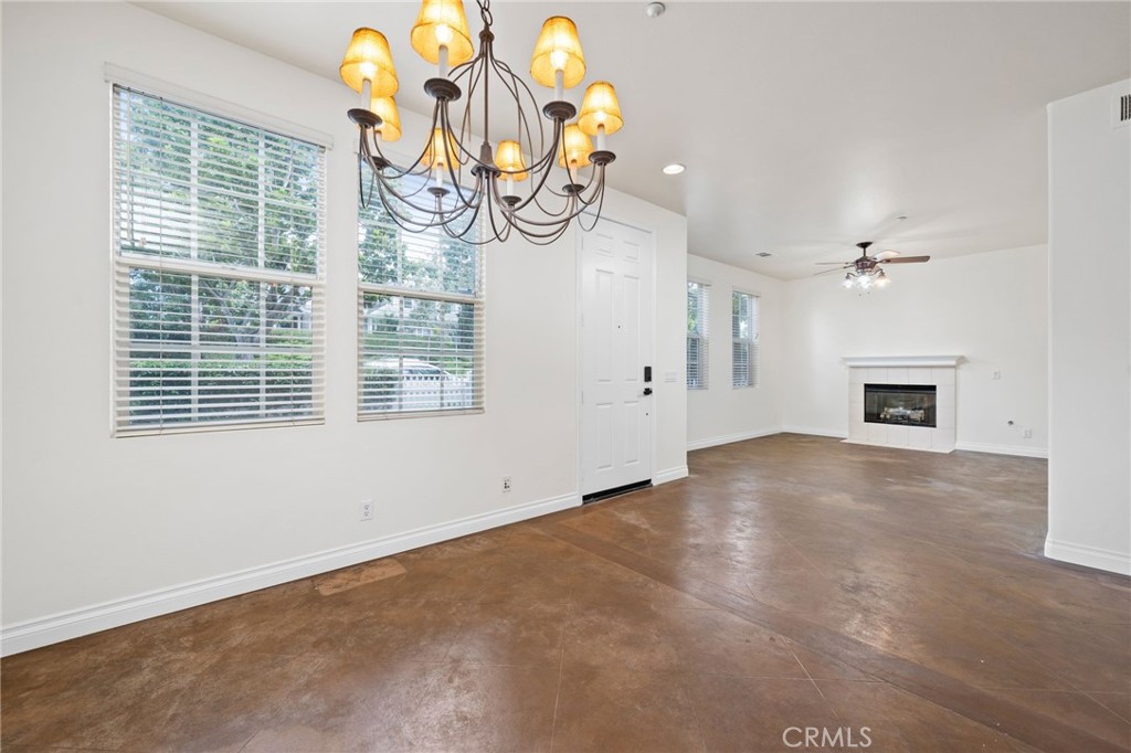 3 Wildflower Place Ladera Ranch, CA 92694 - Photo 14 of 32 en empty room with windows and fireplace