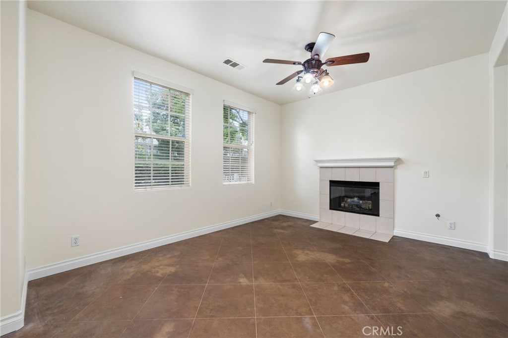 3 Wildflower Place Ladera Ranch, CA 92694 - Photo 16 of 32 an empty room with windows and fireplace